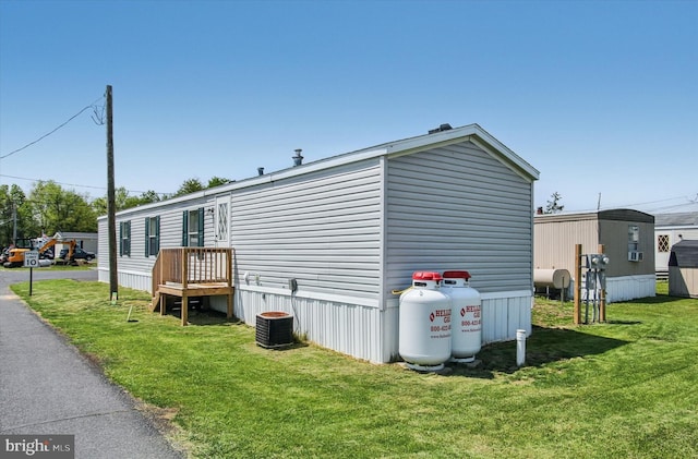 exterior space featuring a lawn and heating fuel