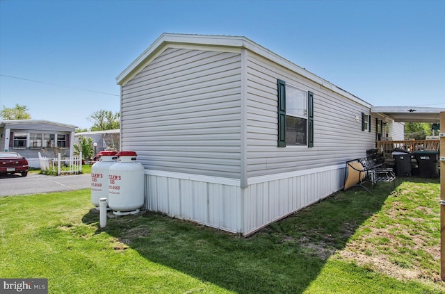 view of home's exterior featuring a yard