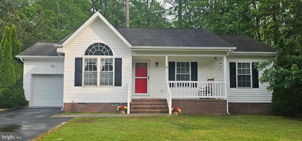 view of front of home featuring an attached garage, aphalt driveway, a front yard, crawl space, and a porch