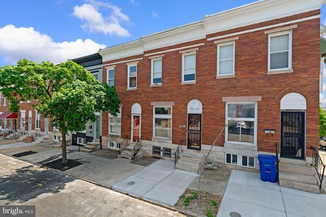 multi unit property with brick siding and entry steps