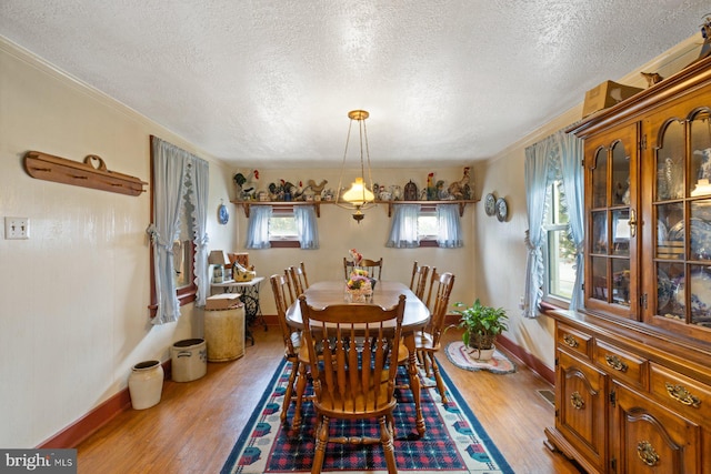 621 Gay St, Hanover, PA 17331 - dining space featuring a textured ceiling, wood finished floors, and baseboards
