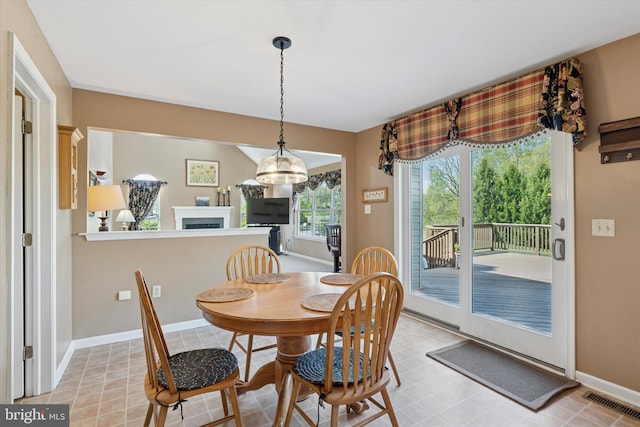 dining area featuring baseboards and visible vents