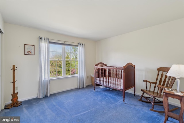 carpeted bedroom featuring baseboards