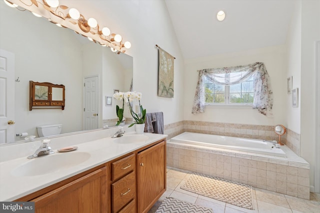 bathroom featuring a sink, tile patterned flooring, toilet, and a bath