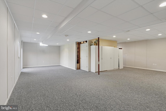 finished below grade area with carpet flooring, recessed lighting, and baseboards