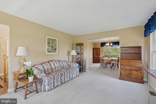 living room featuring baseboards and carpet floors