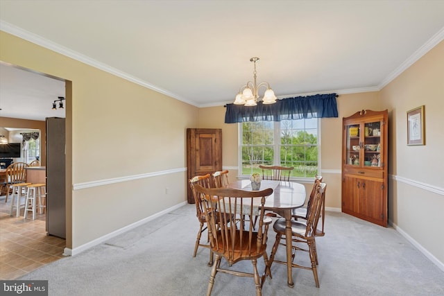 dining space featuring plenty of natural light, ornamental molding, and a chandelier