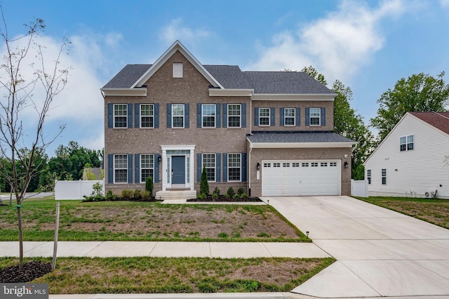 5615 Savannah Dr, Brandywine, MD 20613 - colonial inspired home with fence, an attached garage, concrete driveway, and brick siding