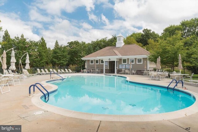 137 Mahogany Way, Upper Gwynedd, PA 19446 - community pool with a patio area and view of wooded area