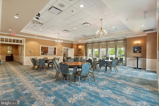 137 Mahogany Way, Upper Gwynedd, PA 19446 - carpeted dining space featuring a raised ceiling, a chandelier, ornamental molding, and a wainscoted wall