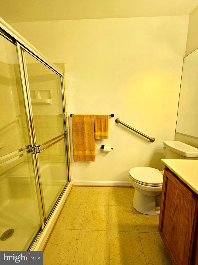 6620 Lake Park Dr Unit 2D 201, Greenbelt, MD 20770 - bathroom featuring a shower with door, vanity, toilet, and baseboards