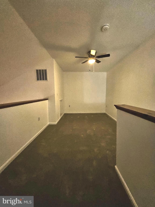 6620 Lake Park Dr Unit 2D 201, Greenbelt, MD 20770 - spare room featuring dark carpet, baseboards, ceiling fan, a textured ceiling, and a smoke detector