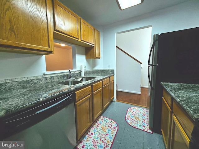 6620 Lake Park Dr Unit 2D 201, Greenbelt, MD 20770 - kitchen featuring appliances with stainless steel finishes, a sink, dark floors, and brown cabinets