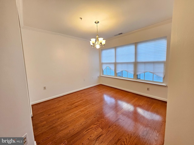 6620 Lake Park Dr Unit 2D 201, Greenbelt, MD 20770 - spare room with crown molding, a chandelier, baseboards, wood finished floors, and a pendent fire sprinkler