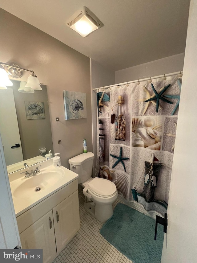 7918 Bentley Village Dr Unit 14A, Springfield, VA 22152 - bathroom featuring vanity, toilet, a shower with shower curtain, and tile patterned floors