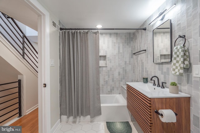2019 Pemberton St, Philadelphia, PA 19146 - bathroom featuring shower / tub combo with curtain, vanity, tile walls, and tile patterned flooring