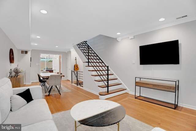 2019 Pemberton St, Philadelphia, PA 19146 - living area with stairs, wood finished floors, recessed lighting, baseboards, and crown molding