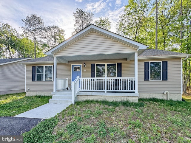 view of front of house featuring a porch and a shingled roof
