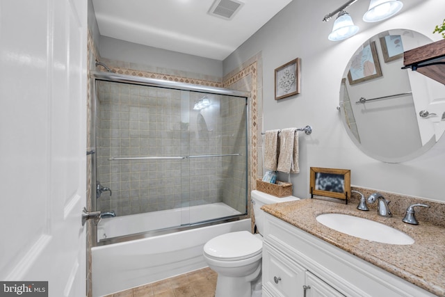 full bath featuring tile patterned flooring, vanity, toilet, enclosed tub / shower combo, and visible vents