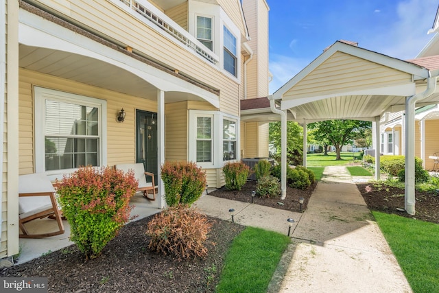 doorway to property featuring covered porch