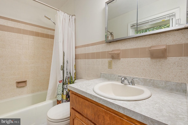 full bathroom with vanity, toilet, and shower / tub combo with curtain