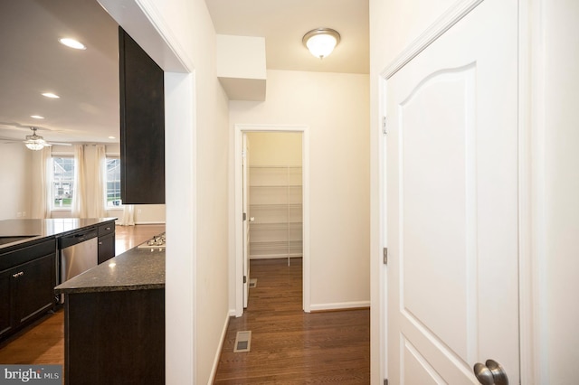 hallway with recessed lighting, baseboards, dark wood finished floors, and visible vents