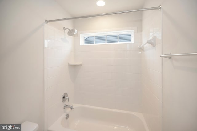 bathroom with toilet and  shower combination
