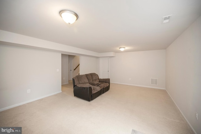 unfurnished room featuring stairway, baseboards, light colored carpet, and visible vents