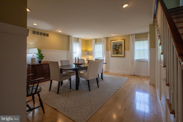 dining room featuring visible vents, recessed lighting, wood-type flooring, and baseboards