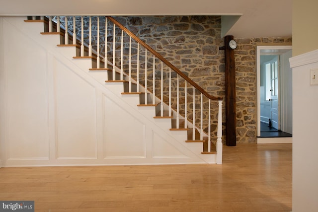 staircase featuring hardwood / wood-style floors