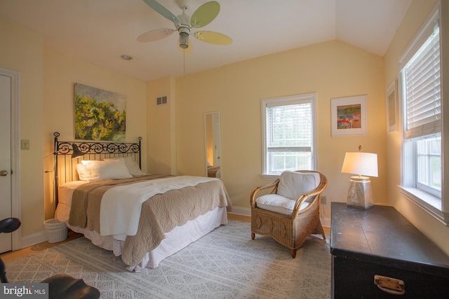 bedroom featuring baseboards, visible vents, ceiling fan, and vaulted ceiling