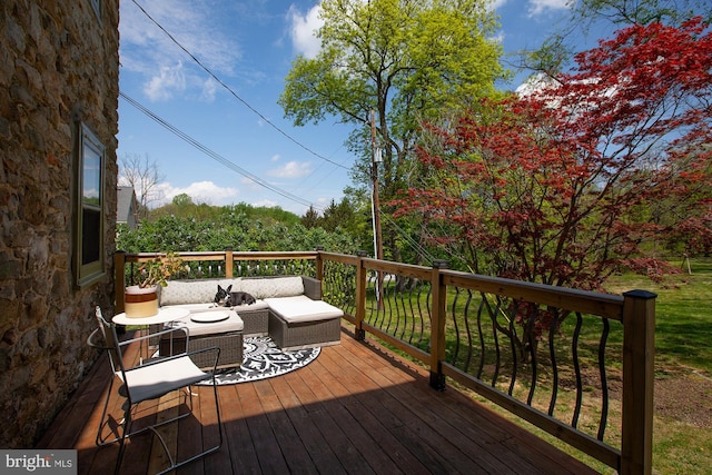 wooden deck featuring an outdoor living space