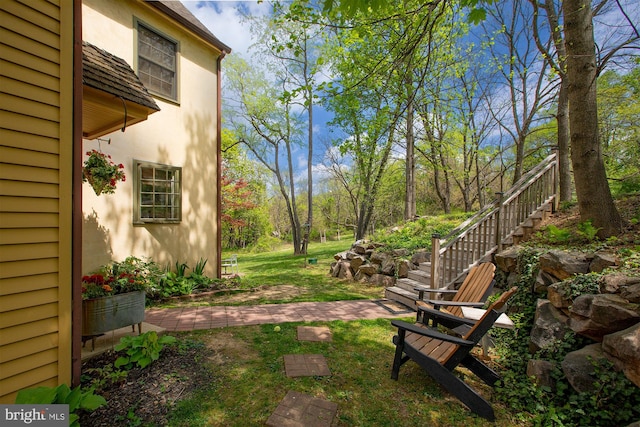 view of yard featuring stairs