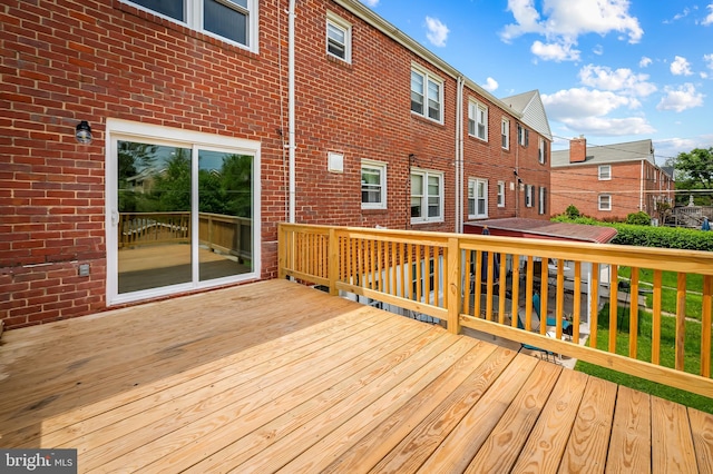 wooden deck with a residential view