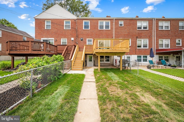 back of property featuring a deck and stairway