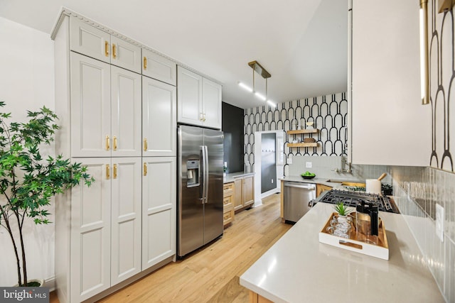 kitchen featuring stainless steel appliances, light countertops, light wood finished floors, open shelves, and tasteful backsplash