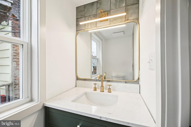 bathroom with vanity and toilet