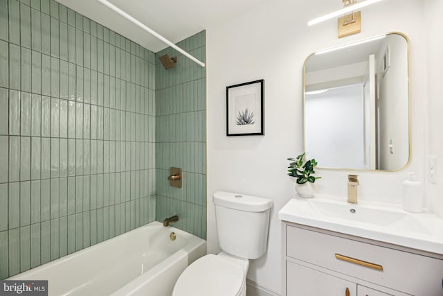 bathroom featuring toilet, bathtub / shower combination, and vanity