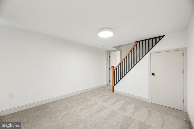 finished basement with carpet floors and stairs