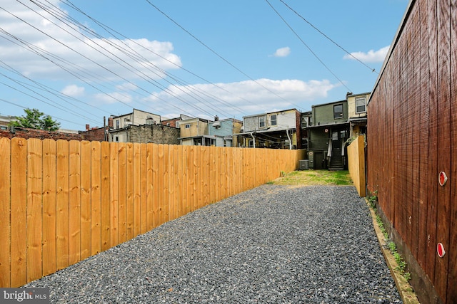 view of yard with fence and a residential view