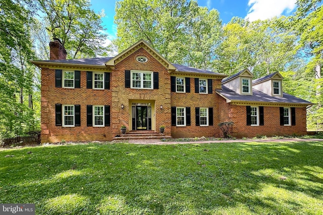 5839 Windsor Retreat, Warrenton, VA 20187 - colonial house with a front lawn, brick siding, a chimney, and fence