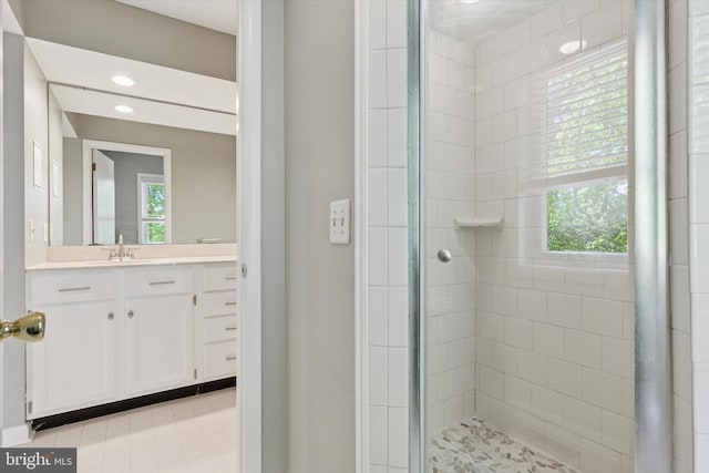 full bath with recessed lighting, tile patterned floors, vanity, and a shower stall