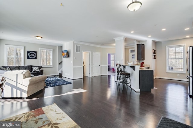 12815 Breyer Pl, Hughesville, MD 20637 - living room with visible vents, baseboards, stairs, and a healthy amount of sunlight