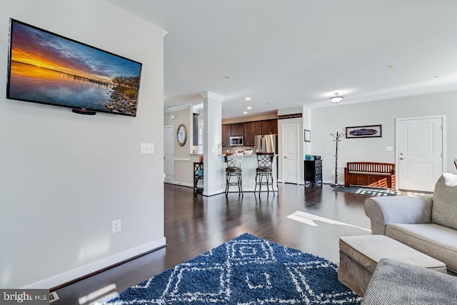 12815 Breyer Pl, Hughesville, MD 20637 - living room featuring recessed lighting, baseboards, decorative columns, and dark wood-style flooring
