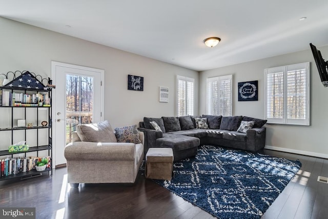 12815 Breyer Pl, Hughesville, MD 20637 - living area with baseboards, plenty of natural light, and dark wood-style flooring