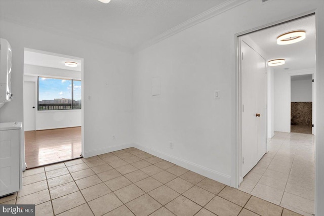 3709 S George Mason Dr Unit 1109E, Falls Church, VA 22041 - spare room featuring light tile patterned floors, baseboards, and ornamental molding