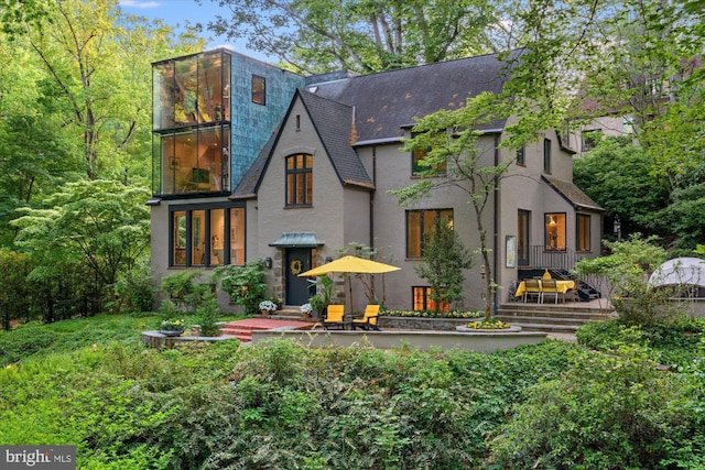 2871 Audubon Ter NW, Washington, DC 20008 - rear view of property with stucco siding and roof with shingles