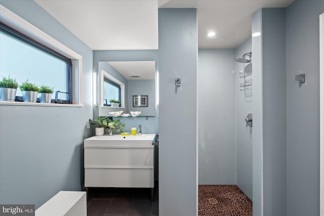 2871 Audubon Ter NW, Washington, DC 20008 - bathroom with recessed lighting, visible vents, a tile shower, tile patterned flooring, and vanity