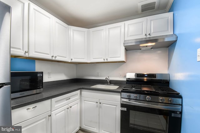 4555 Macarthur Blvd NW Unit 202, Washington, DC 20007 - kitchen with appliances with stainless steel finishes, under cabinet range hood, dark countertops, and white cabinets