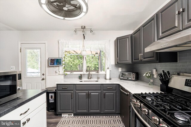 150 Elton Ave, Hamilton, NJ 08620 - kitchen with a sink, appliances with stainless steel finishes, under cabinet range hood, and a healthy amount of sunlight